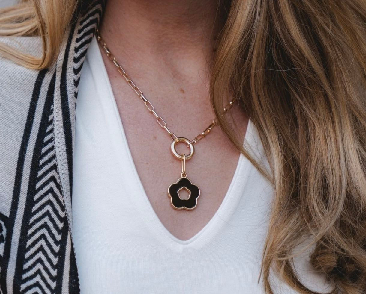 Black hanging flower with gold chain linked necklace 