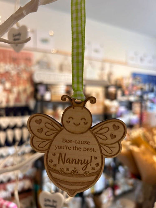Wooden bee hanging decoration with ribbon engraved “Bee-cause you’re the best, Nanny!
