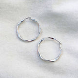 Silver twisted hoops by jack and freda