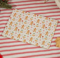 A festive set of four placemats in a charming gingerbread repeat print. Little gingerbread men, Christmas puddings, candy canes, hearts and sprigs of holly dance across a warm cream background, which makes them a cheerful addition to Christmas breakfasts, family dinners and festive baking sessions. The wooden placemats are heat resistant to help protect your table, and they wipe clean easily. They look lovely mixed with red-striped linen and traditional Christmas tableware. A thoughtful gift for hosts, new 
