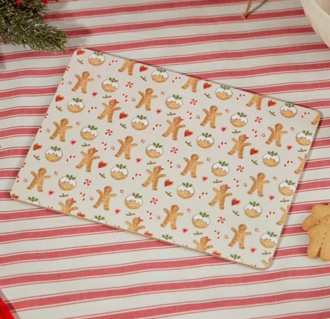 A festive set of four placemats in a charming gingerbread repeat print. Little gingerbread men, Christmas puddings, candy canes, hearts and sprigs of holly dance across a warm cream background, which makes them a cheerful addition to Christmas breakfasts, family dinners and festive baking sessions. The wooden placemats are heat resistant to help protect your table, and they wipe clean easily. They look lovely mixed with red-striped linen and traditional Christmas tableware. A thoughtful gift for hosts, new 