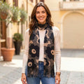 Oversized bold black and taupe poppy print scarf with fringe ends, draped to show the full retro Scandinavian-inspired floral design.