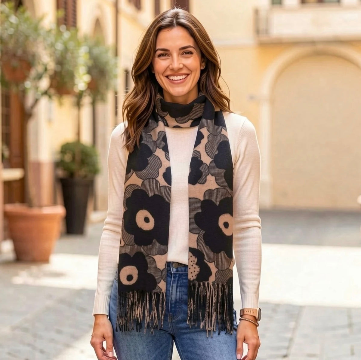 Oversized bold black and taupe poppy print scarf with fringe ends, draped to show the full retro Scandinavian-inspired floral design.