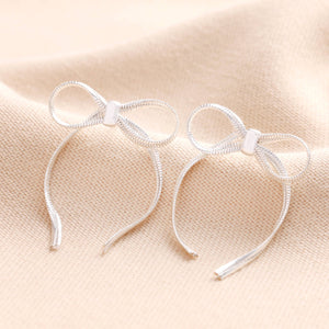 Bow statement silver earrings