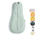 Baby in ergoPouch Cocoon Swaddle Bag 1.0 TOG in sage green with leaf print