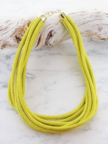 Chunky multi strand cord necklace in lime yellow with gold tone end caps and extender chain