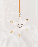 White Star Ceramic Ornament With a Smiley Face & Gold Tips