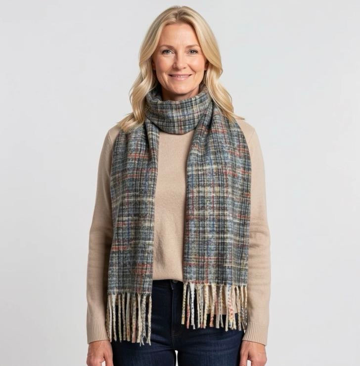 Green multicolour check scarf with cream tassel ends styled on a mannequin