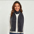 Charcoal grey knit scarf with cream stitched edge styled on a mannequin