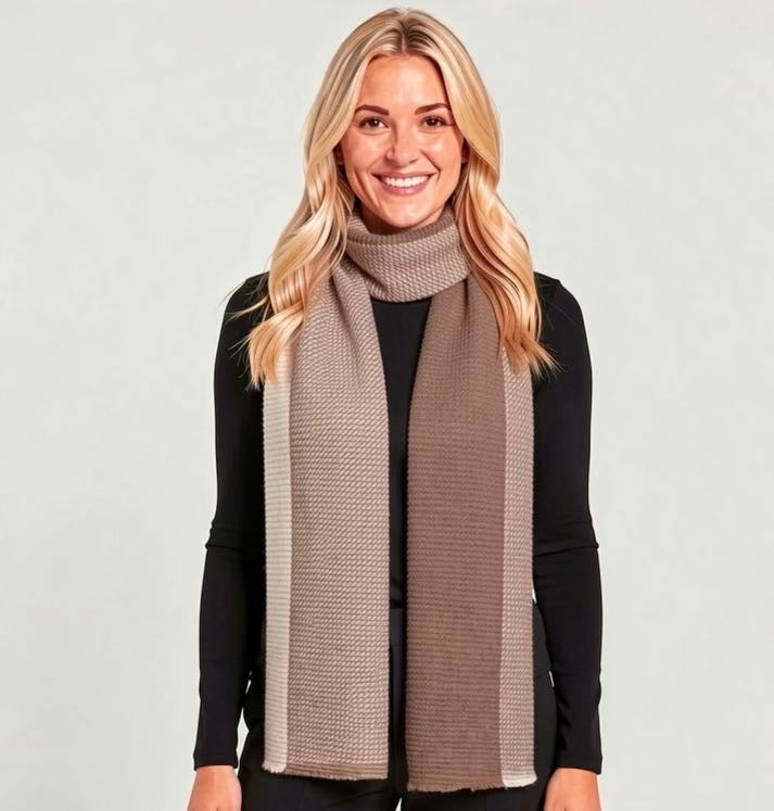 A soft two-tone taupe mocha brown and cream ivory woven wrap scarf with a diagonal ribbed texture and fringe hem, styled as an elegant gift for her.