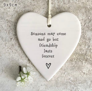 Seasons may come and go but friendship lasts forever hanging heart