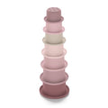 Tower of pink and mauve stacking cups with a sprinkle top cup