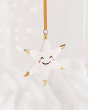 White Star Ceramic Ornament With a Smiley Face & Gold Tips