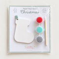 Paint Your Own Christmas craft kit with a stocking shape, ribbon, three paint pots and brush in a cellophane pack
