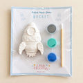  Paint Your Own Rocket craft kit with plaster rocket, three paint pots and brush in a cellophane pack