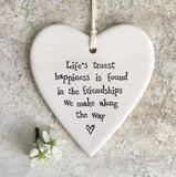 Life's truest happiness is found in the friendships we make along the way'.hanging heart